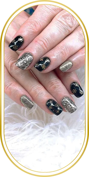 Close-up of black, silver, and glitter nail art on manicured hands